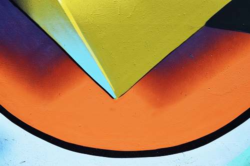 color closeup photo of yellow, white, and orange painted wall painting