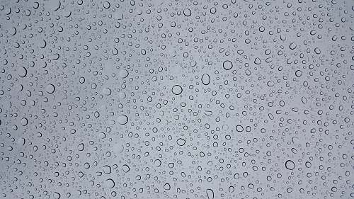 grey selective focus photography of water droplets background
