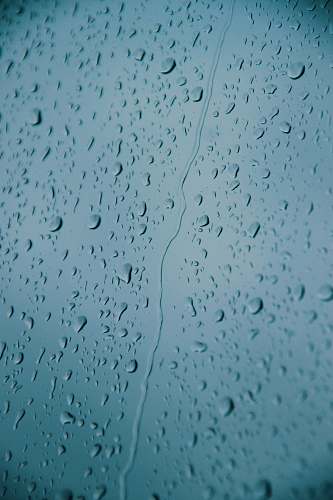 droplet water drops on glass panel grey