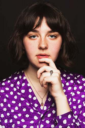 human woman holding chin close-up photography person