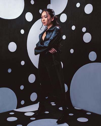 human woman in black coat standing person