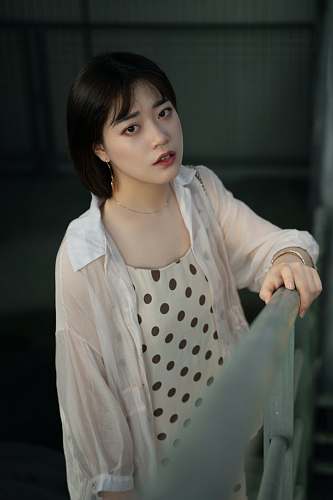 human woman standing beside railings person