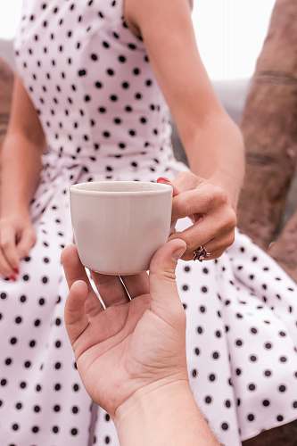 human women;s white polka dot dress close-up photography person