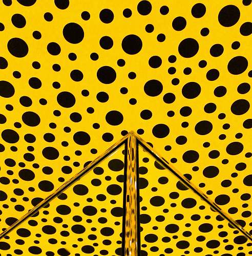 yellow yellow and black polka-dot wall triangle