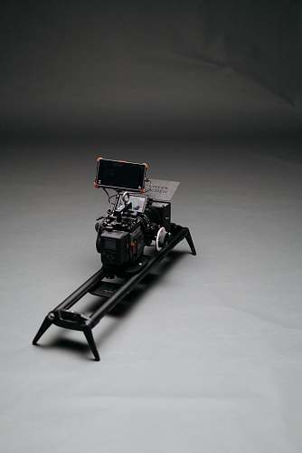 grey black video camera with slider machine