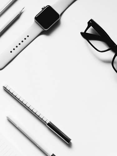 white eyeglasses on white surface glasses