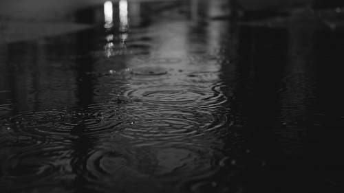 water rippling body of water grey