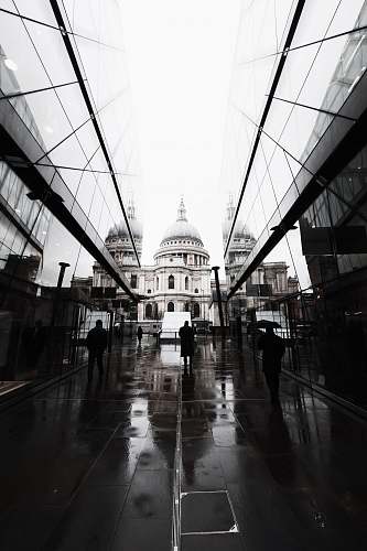 london three person walking on street sidewalk