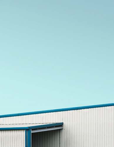slough closeup photo of white and blue metal fence united kingdom