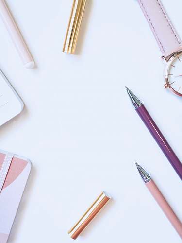 watch purple and pink ball point pen on table coffs harbour