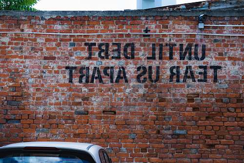 lxmarket until debt tear us apart brick wall vandal lisboa