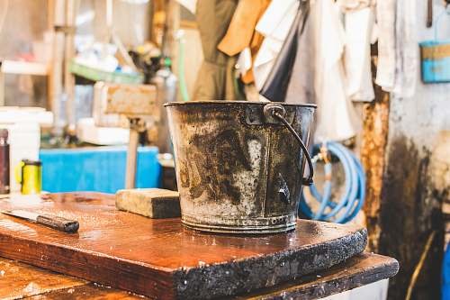 tokyo gray bucket on wooden table pale