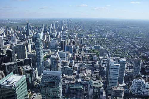 city aerial view photography of city buildings under clear blue sky during daytime skyscraper