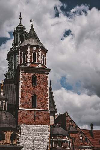 architecture brown and white bricked building tower
