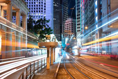 city cars with headlights in city street metropolis