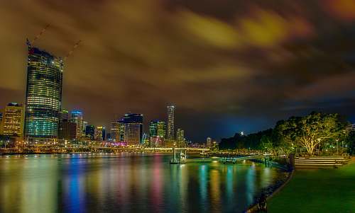 river city lights reflecting on body of water night