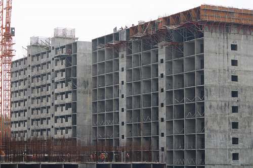 city concrete buildings during daytime high rise