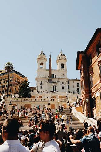 human crowd near cathedral person