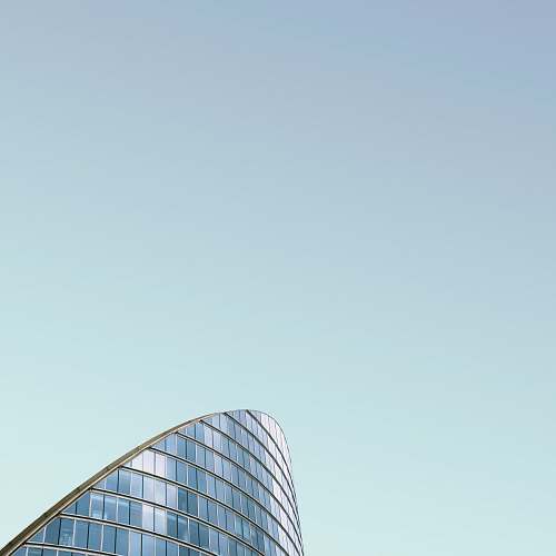 blue curtain wall building under blue sky london