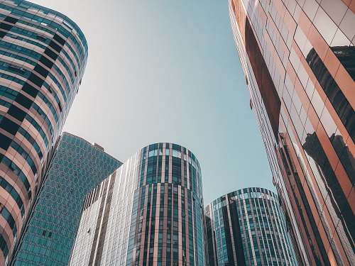city glass buildings under blue sky during daytimne skyscraper