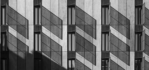 city gray concrete building poster black-and-white