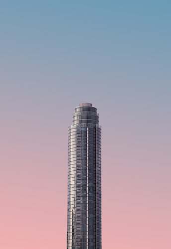 architecture gray tower building under blue sky grey