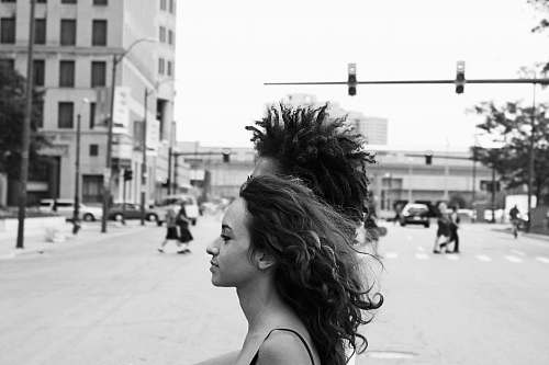 town grayscale photography of woman face black-and-white