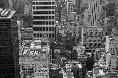city high-rise building in grayscale photography black-and-white