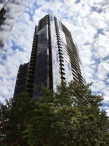 urban low angle photo of black building high rise