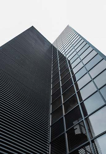architecture low angle photography of black glass building madrid