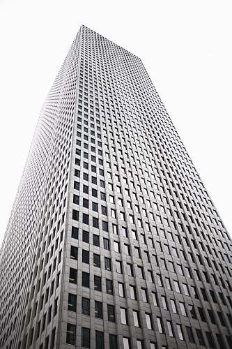 black-and-white low-angle photography of gray high rise building grey