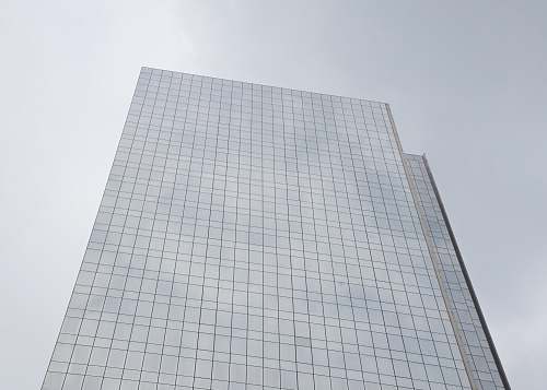 city low angle photography of high-rise photo office building