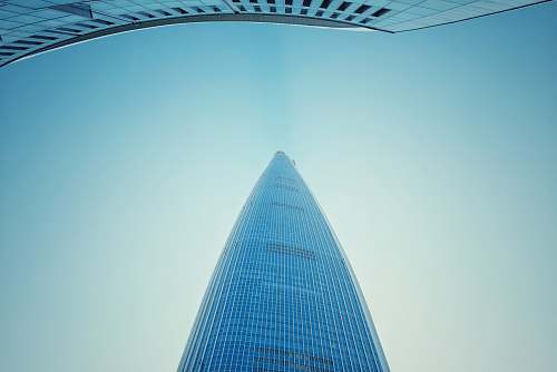 city low-angle view photography of blue mirror building high rise