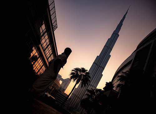 architecture person standing near tower tower