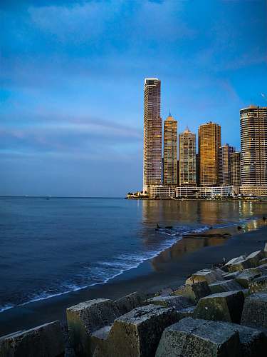 city sea surrounded by buildings high rise