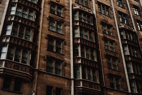 housing structure photography of brown concrete building city