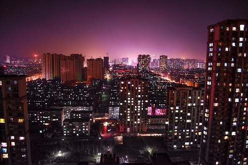 city top view of high rise buildings during nighttie urban
