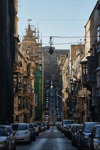 city urban photo of a city street with parked cars metropolis