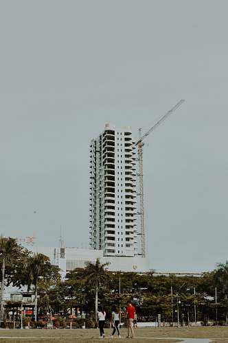 human white concrete building at daytime person