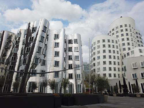 city white concrete building photo high rise