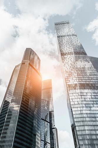 urban worm view photo of buildings under cloudy sky during daytime city