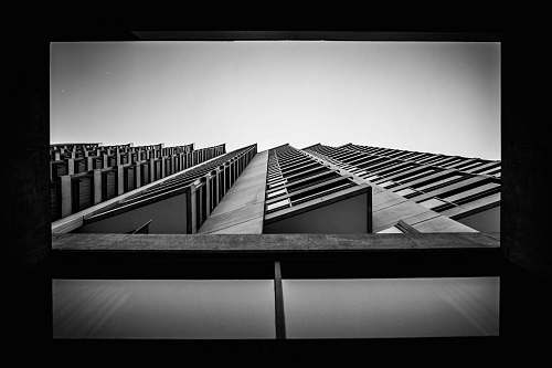 architecture worm's eyeview of multi-storey building black-and-white
