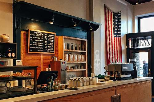 coffee flag of U.S. America hanging on white painted concrete wall shop