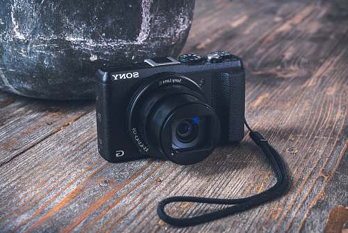 strap black Sony digital camera on table electronics