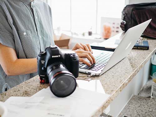electronics person using MacBook laptop