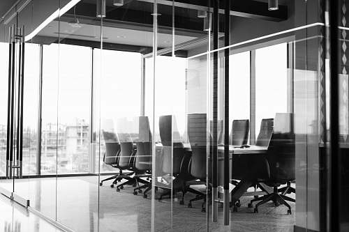 office grayscale photography of corporate room black-and-white