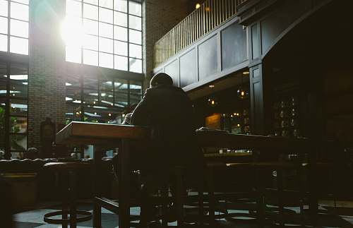 cafe man seating on bar stool furniture