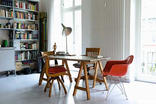 furniture photography of brown wooden dining set near window table