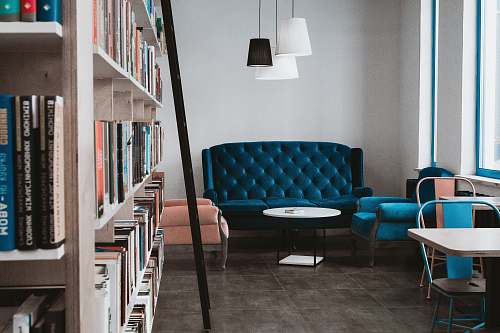 furniture tufted blue 3-seat sofa near white wall and window kyiv