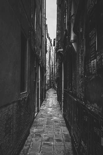 building empty alley grey-scale photography black-and-white